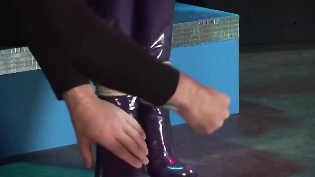 Tasha Marley in shiny purple latex boots and pants BDSM tease