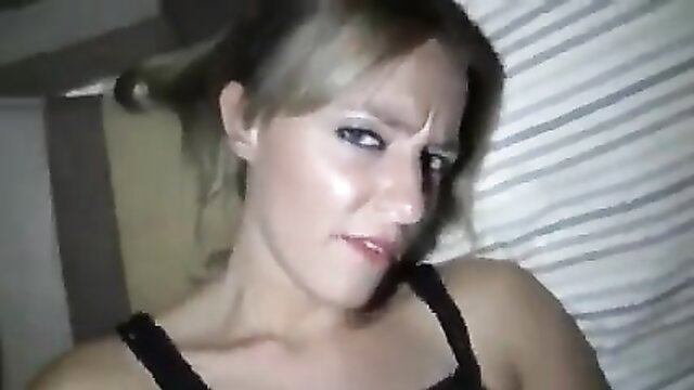Hot blonde with sultry smirk in tight black top, birthday surprise tease