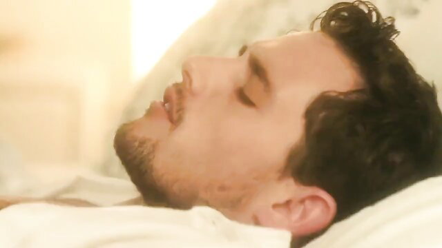 Tyler Nixon sleeping shirtless in bed, handsome bearded hunk