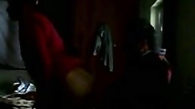 Desi Muslim woman in red top making out passionately with BF