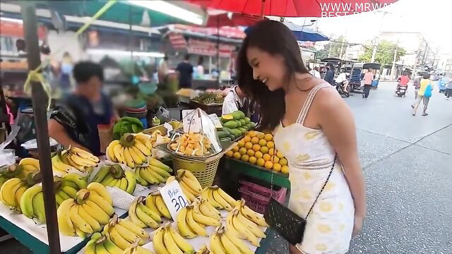 Asian wife in floral sundress at banana market, vibrator remote play tease