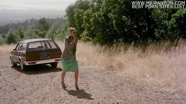 1978 Hot Lunch blonde in green dress by roadside classic car cmnm