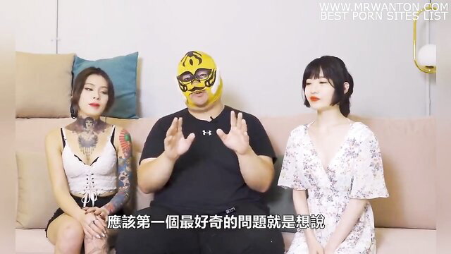 Liu Yue with tattooed Asian girl and masked man on couch interview