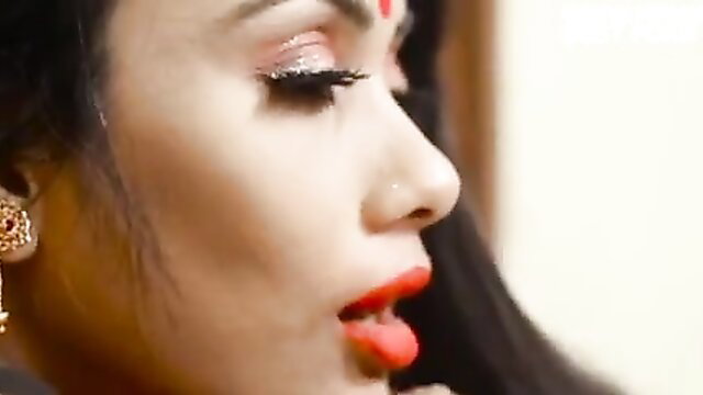 Closeup of sexy Indian bhabhi Nancy with sindoor, red lips, heavy makeup
