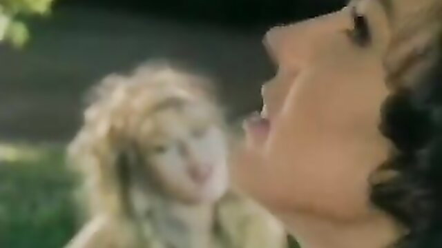 Blonde bombshell with big lips and wild hair in closeup outdoor tease