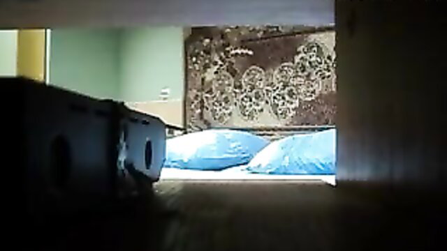 Latina mom on bed with blue pillows in taboo homemade scene