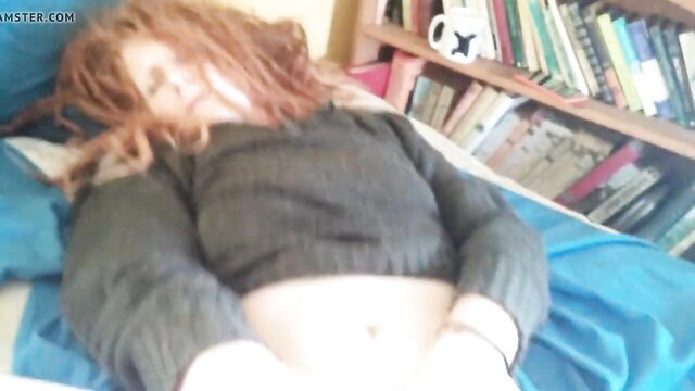 Redhead Daisy cums hard solo on bed in cropped sweater