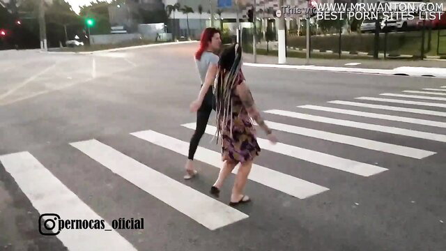 Emi Rippi and friend crossing street in leggings, colorful dress, hot public tease