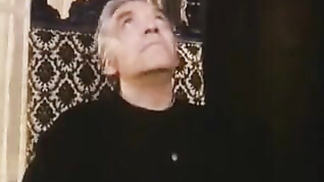 Mature gray-haired man looking up in classic priest fuck scene