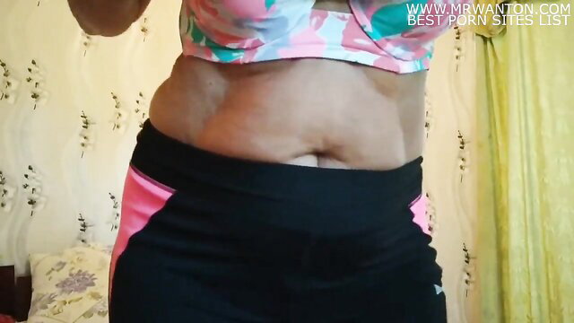 Chubby Lukerya dances in pink bikini top and black leggings