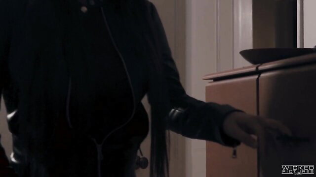 Horny mom in leather jacket leans over table getting fingered