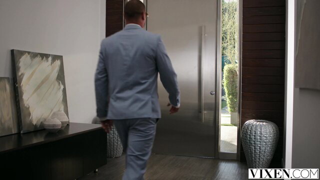 Quinton James in suit enters door in Tushy Fixer Part 3 with Lulu Chu