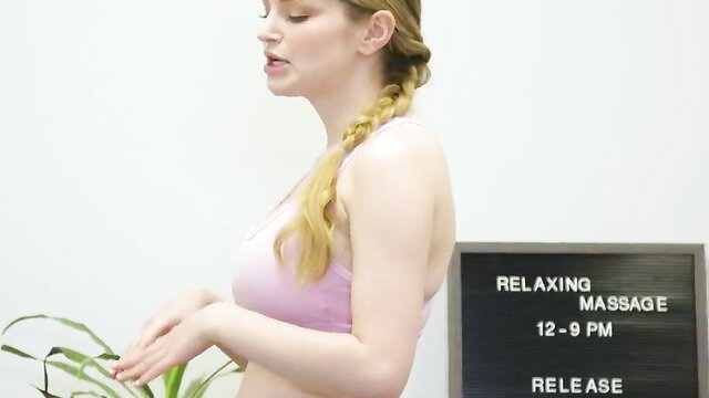 Lauren Phillips in pink sports bra at relaxing massage