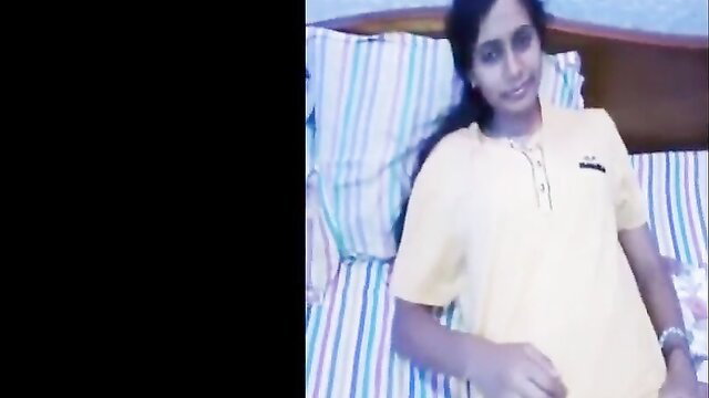 Smiling Indian wife in yellow top on bed, amateur desi happy ending