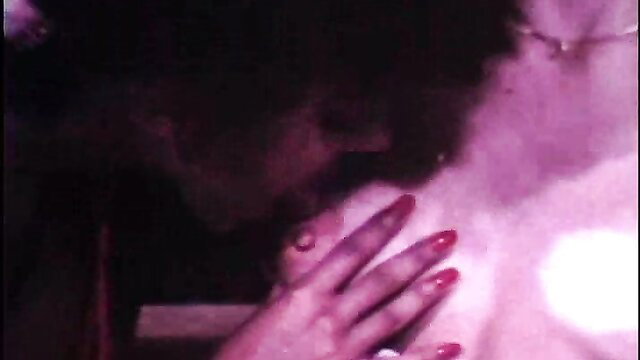 Gina Martell grabs Shanna Evans' big tits in retro lesbian porn