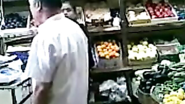Pakistani guy in market stall with fruits, Desi Papa amateur scene