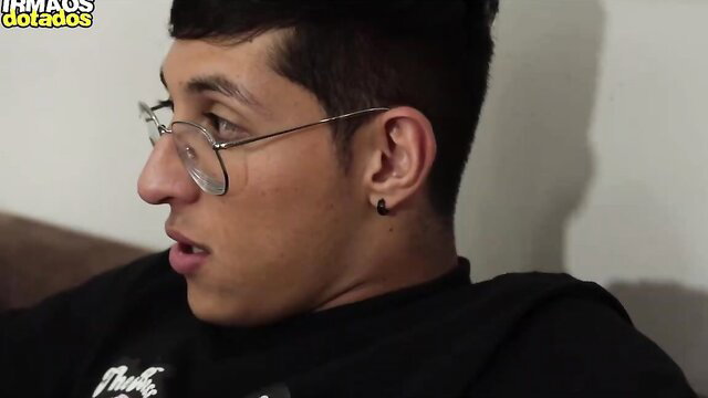Handsome young Latino man in glasses smirks in step-friend threesome preview