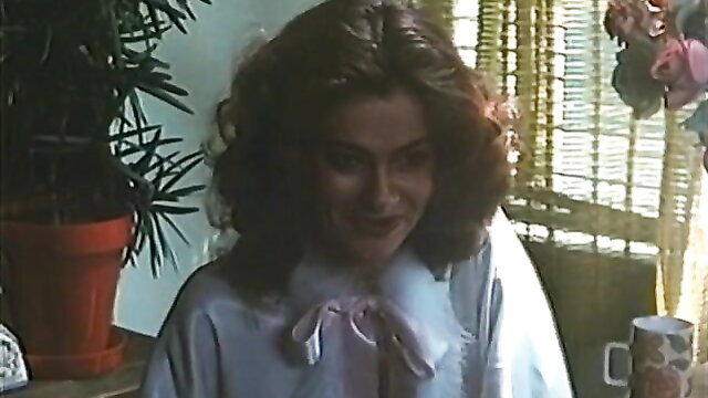 Vintage Essex Video babe in fur-trimmed robe smiles seductively