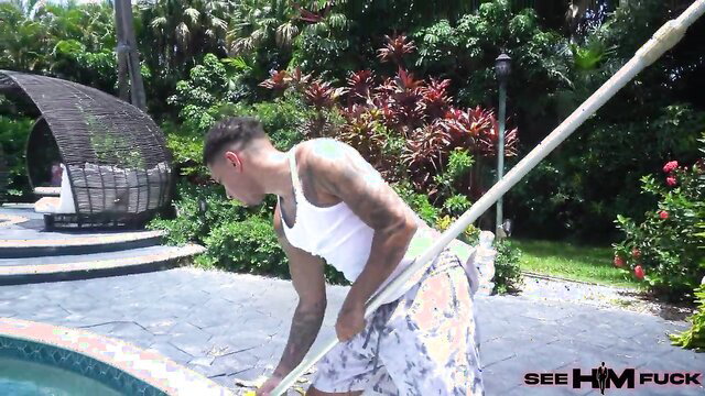 Air Thugger as tattooed handyman in tank top and shorts by pool