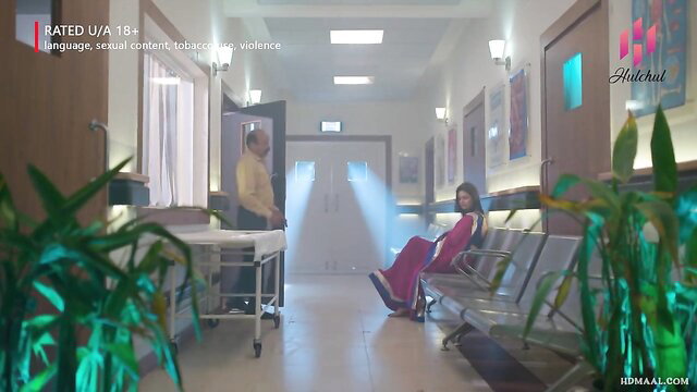 Indian woman in red dress sits seductively in hospital with man, Hulchul web series