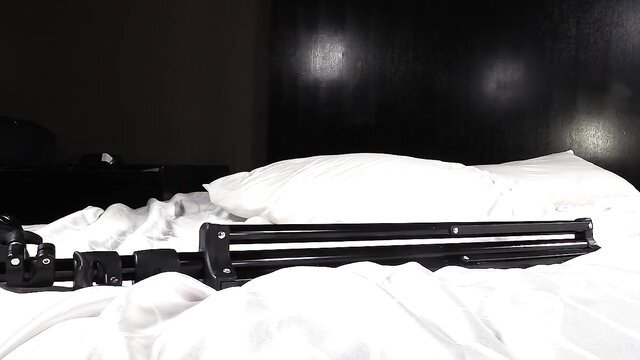 Black Ambush Stacy tripods on bed in hotel room ambush setup