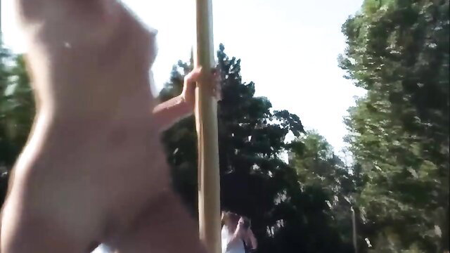 Nude blonde pole dancing outdoors at Nudes A Poppin, Buttman 15