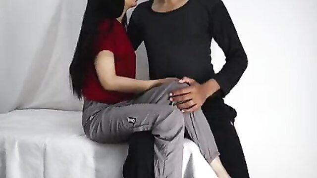 Indian 18yo teen girl in red top grey pants kissed by guy on bed