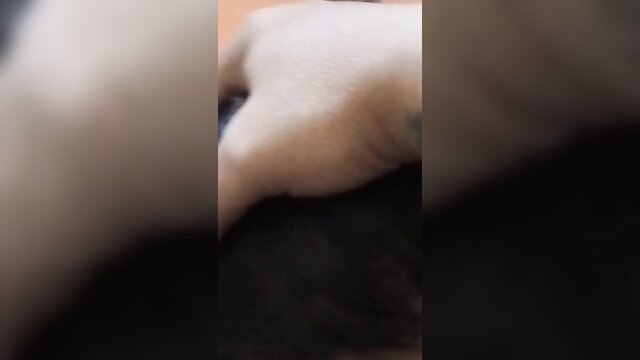 Blurry closeup of Indonesian wife's pale hand gripping dark cock cheating affair
