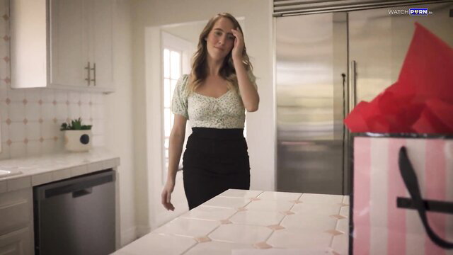 Cadence Lux in off-shoulder top and skirt in kitchen