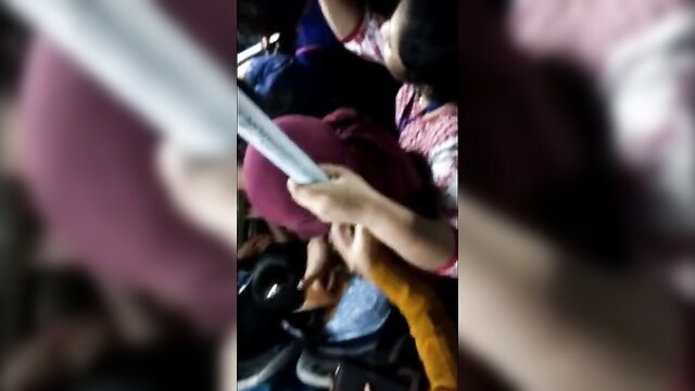 Woman being groped on a crowded bus