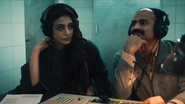 Indian actress in headphones at desk in steamy Khufiya sex scene