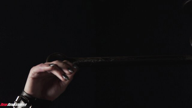 Natalia Starr holds long black dildo teasingly in dark 4K scene