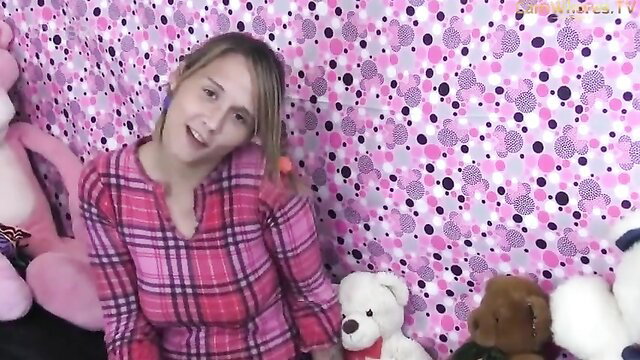 Mahalo Marcy in pink plaid pajamas with teddy bears, smiling playfully