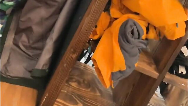 Restaurant handjob with orange towels and clothes on wooden shelf