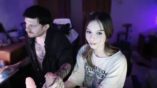 Gamebelka camgirl CFNM domination: girl holds dildo over tattooed guy's lap