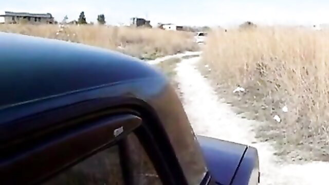 Country girl in car on rural path, naughty amateur tease