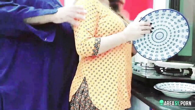 Pakistani wife in yellow salwar kameez tempts husband in kitchen