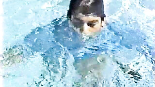 Vintage twink swimmer in pool, wet swim cap and speedo bulge closeup