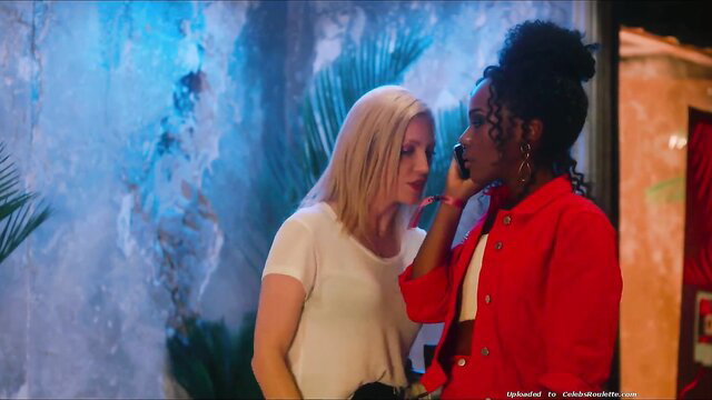 Brittany Snow whispering intimately with black woman in Someone Great