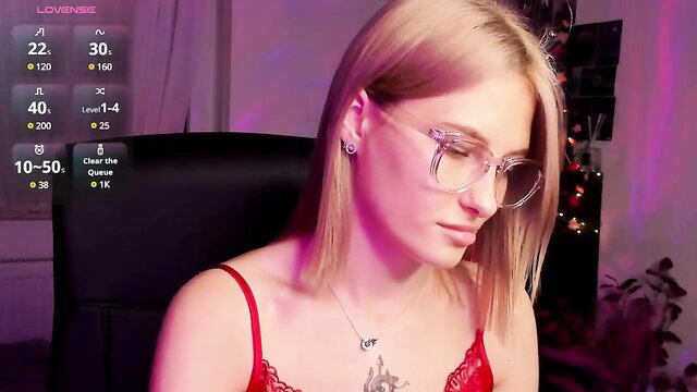 SummerDiana on MyFreeCams in red lingerie, blonde bob, glasses closeup