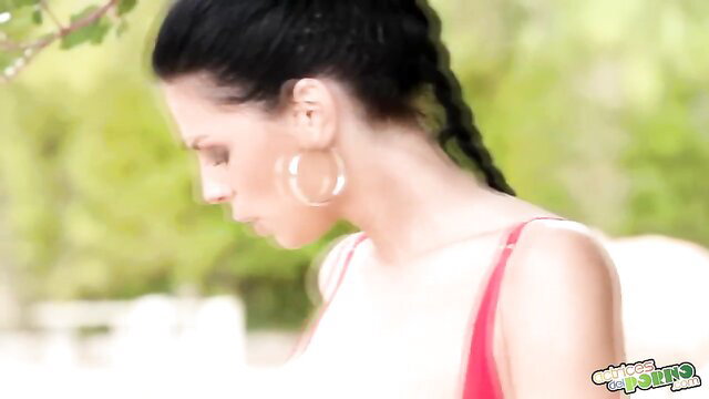 Alyssia Loop in red top, big hoop earrings, black braid, outdoor tease