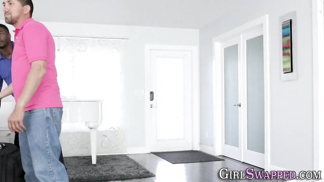 Black guys greet pink-shirted man at door in GirlSwapped swap scene
