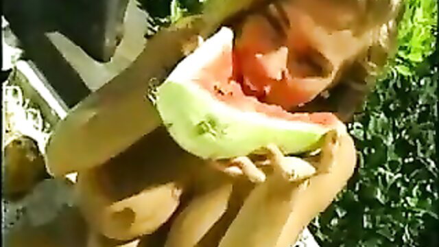 Busty Tiffany Towers nude eating watermelon outdoors