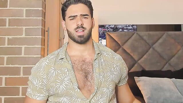 Hunky Latino man Kyler Moss in open shirt showing hairy chest