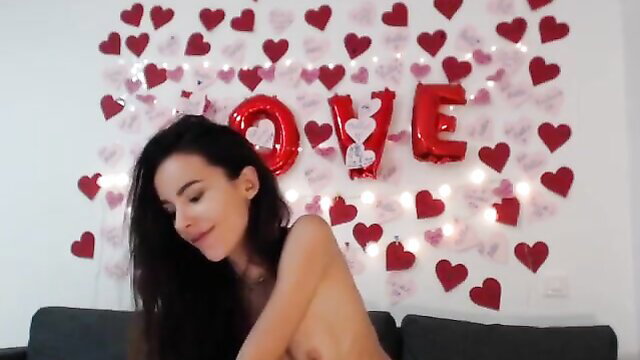 TalentedNat nude on couch with Valentine hearts, seductive smile