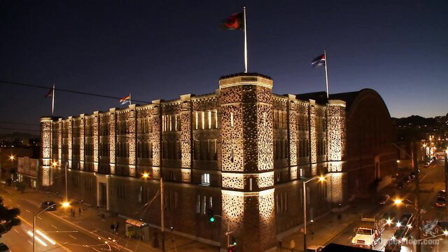 Lit-up castle building at night, freshmeat punishment tease