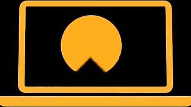 Orange Pac-Man icon on TV screen laptop display adult video thumbnail