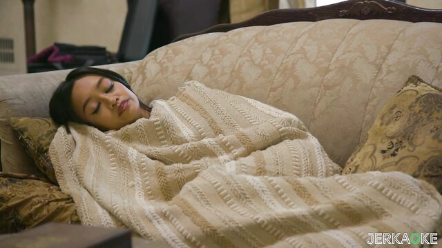Jade Kimiko sleeping cozy in blanket on couch Father's Day