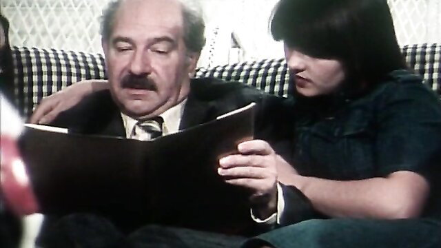 Vintage 1978 porn dad reading book with busty brunette daughter on lap