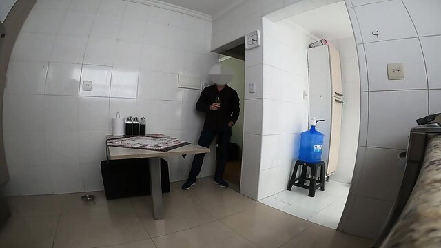 Agatha Lira in kitchen with delivery guy, black jacket black pants